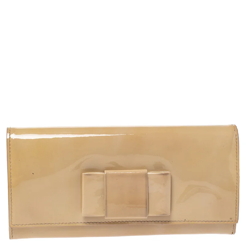 Lightweight wallets for travel -Miu Miu Beige Patent Leather Bow Continental Wallet..