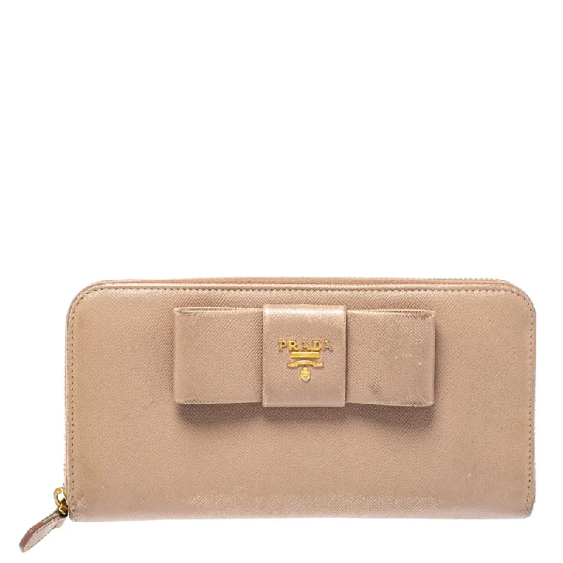 Wallets with built-in coin pouches for convenience -Prada Beige Saffiano Leather Bow Zip Around Wallet..