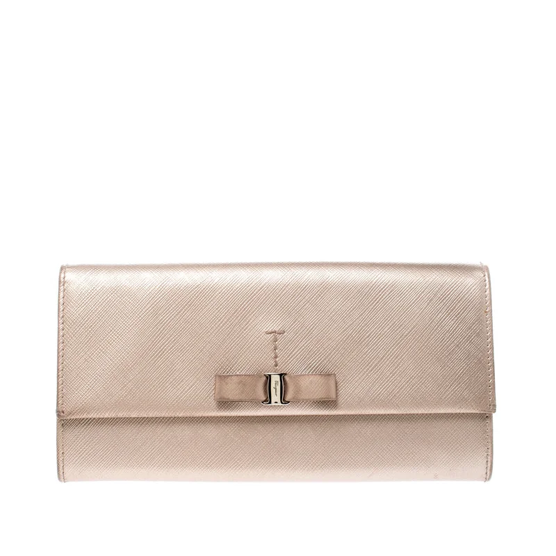 Women’s wallets with zipper for security -Salvatore Ferragamo Beige Metallic Leather Bow Continental Wallet..